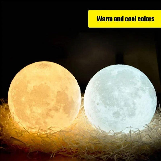  two moon glowing night light lamps sitting on top of a pile of hay