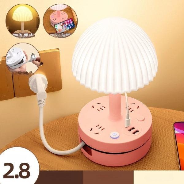 a pink table lamp with a white shade on top of it