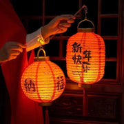 a person holding a lantern in their hand