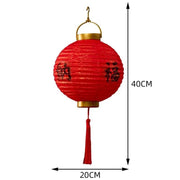 a red paper lantern with chinese writing on it