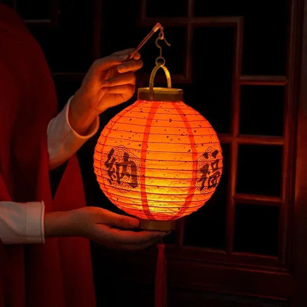 a person holding a lantern in their hand