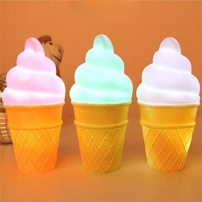 three ice cream cones sitting on top of a table