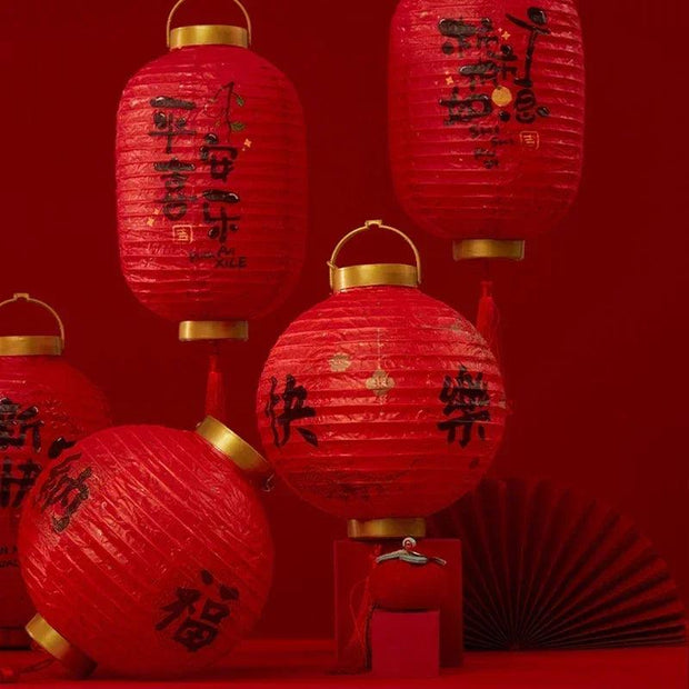 a group of red lanterns sitting on top of a table