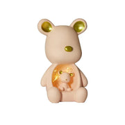 a small toy bear with a baby in it's lap