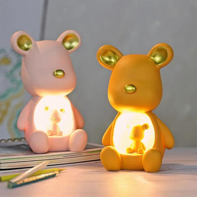 a yellow and a white teddy bear light up